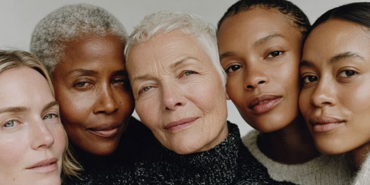 a close up five women of different ages with neutral expressions 