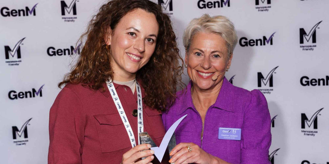 two women holding the gen m award