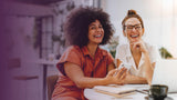 Two women in a work environment with a purple gradient incoming from the left hand side