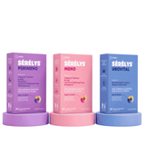 Three UPSA Serélys supplement boxes displayed on matching colored pedestals: purple Perimeno, pink Meno, and blue Urovital.